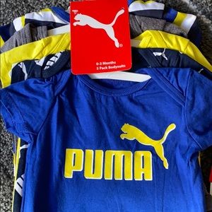 Babies Puma onsies.